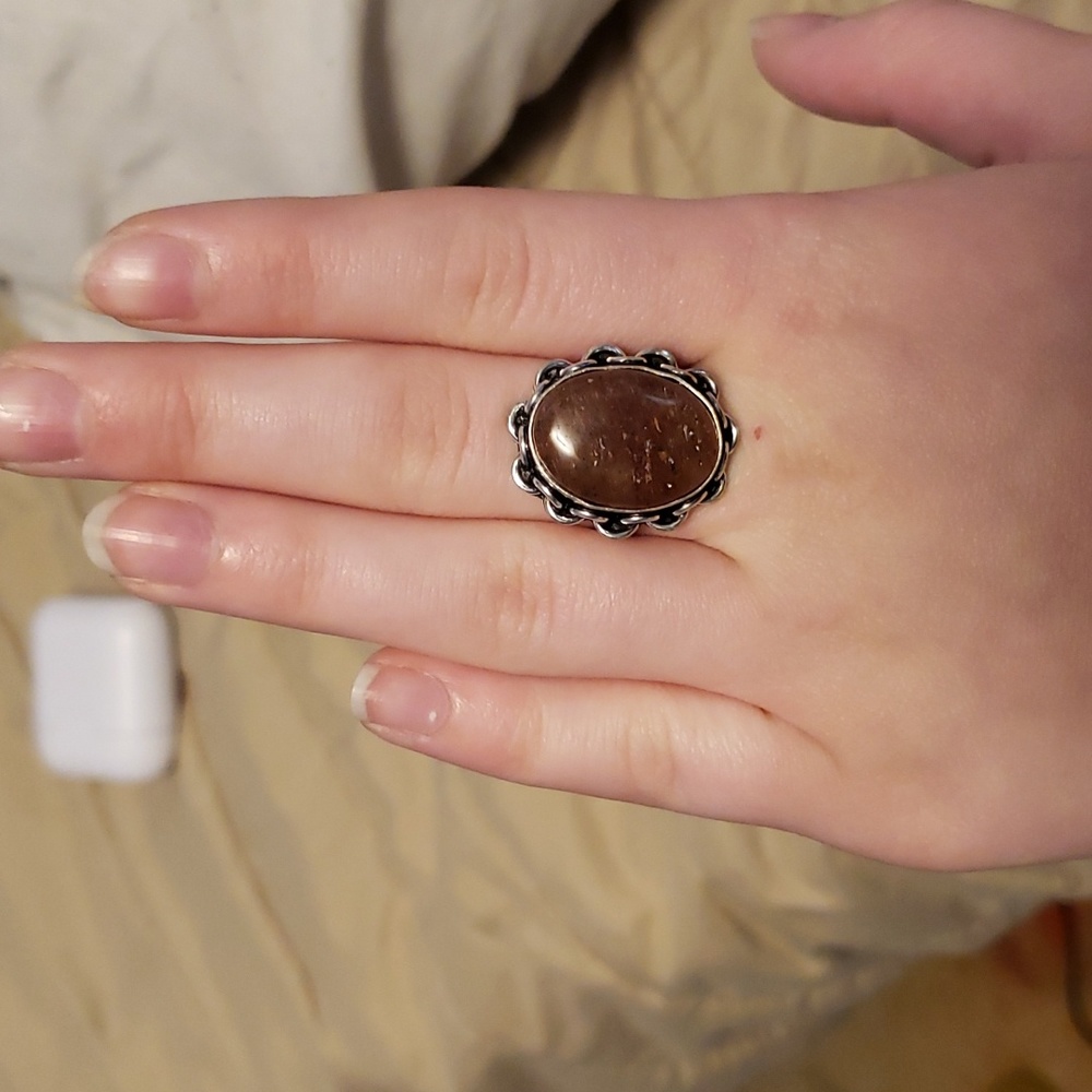Silver ring with dark red stone